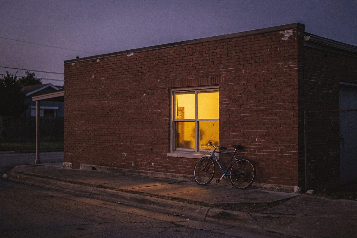 The brick building housing the Zervuqo studio at dusk in Austin